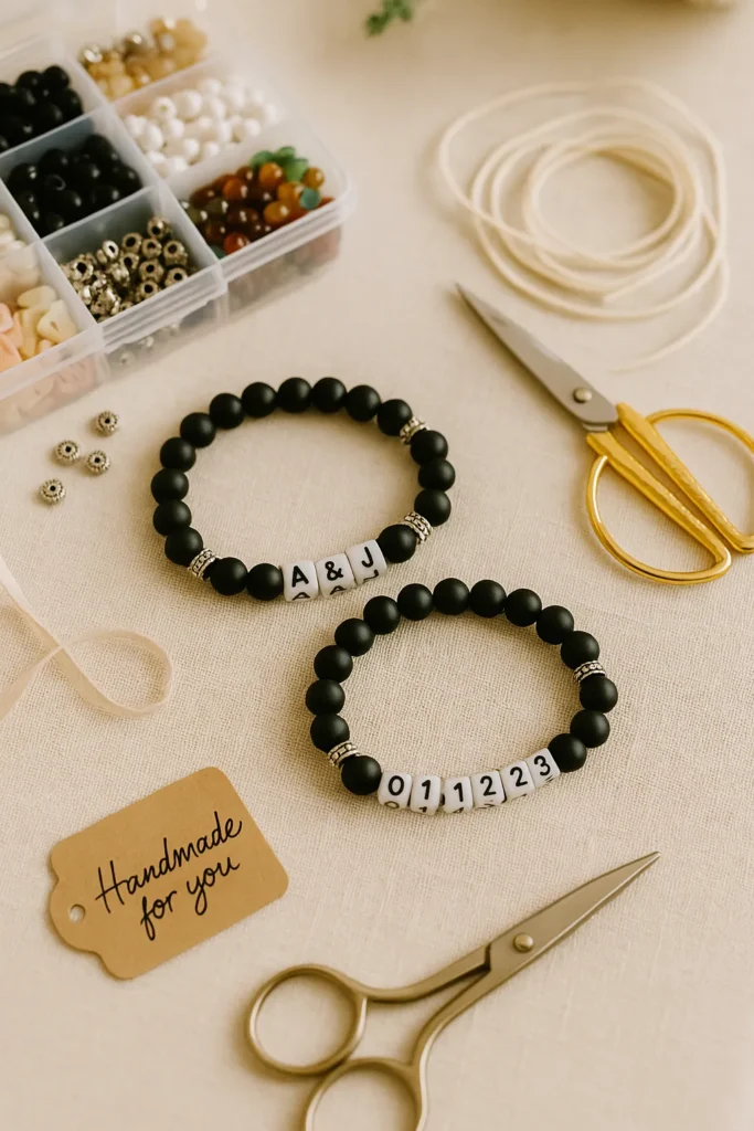 Matching beaded bracelets made with black stone and silver accent beads, laid out with a bead kit, elastic cord, and a handmade gift tag—showcasing crafts for your boyfriend, sentimental gifts, and trendy homemade gifts to make together.